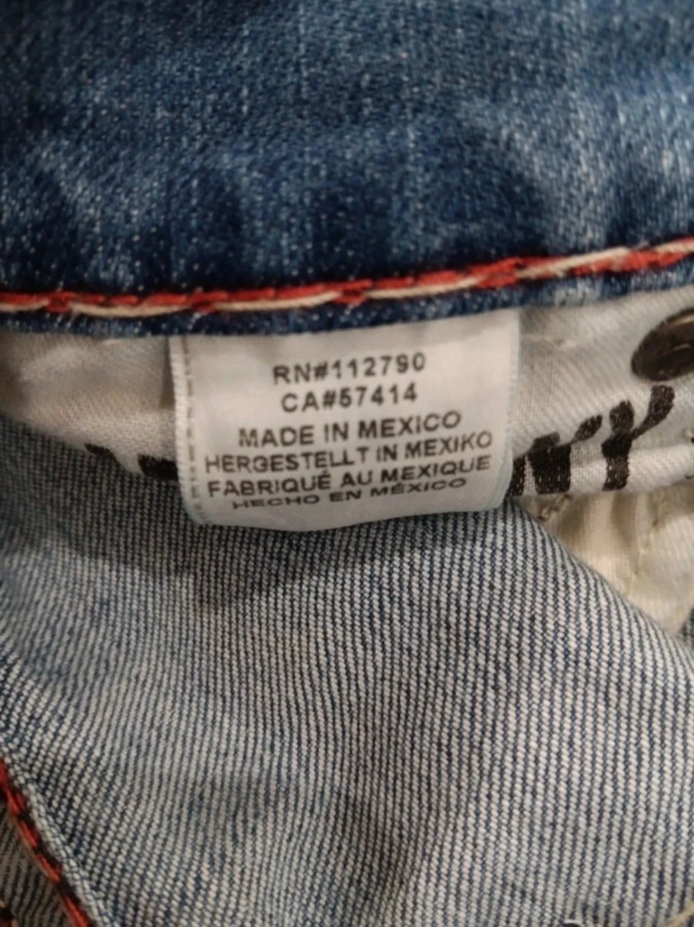 True Religion light blue jeans with red contrast stitching